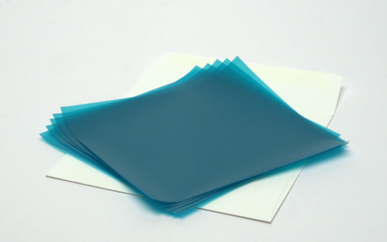 Stack of blue translucent sheets on a white background