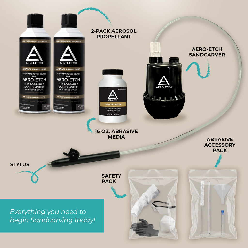 Aero Etch sandcarving tools and accessories on a beige background